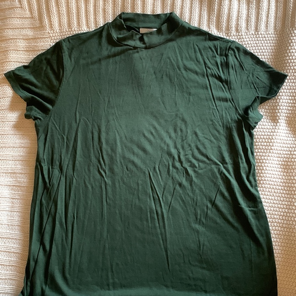 Mock neck, short-sleeve forest green top. Dressier look.